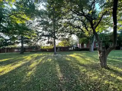 Front lawn and red brick campus of the former children's center in Danville, Illinois